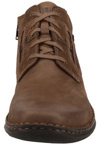 Brown leather lace-up shoe with a rounded toe, stitched accents, and a zipper on the side. Features a textured surface and flexible sole.