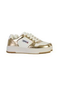 Gold and white athletic sneakers feature a smooth, shiny upper with perforated detail and a white rubber sole. Laces are evenly threaded.