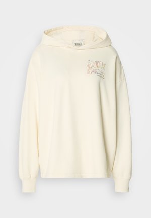 Cremfarbener Hoodie aus weichem Stoff. Verfügt über eine Kapuze mit Kordelzug und ein grafisches Design in Pastellfarben auf der Brust, mit gerippten Bündchen.