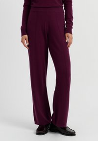 Damen weit geschnittene Hosen aus tiefpurpurnem Strickstoff, mit einem hohen elastischen Bund und vertikalen Nahtdetails für einen maßgeschneiderten Look.