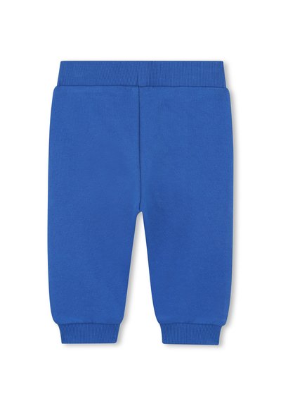 Jogging en coton bleu avec une taille et des poignets côtelés, présentant une texture lisse et une taille élastique pour le confort. Sans motifs ni embellissements.