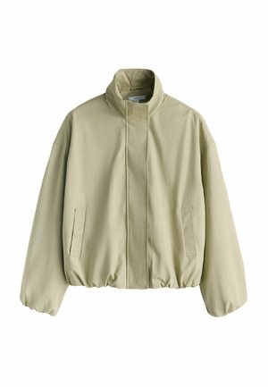 Hellgrüne Bomberjacke mit hohem Kragen, elastischem Bund und zwei Seitentaschen. Glattes Gewebe mit lockerem, übergroßem Schnitt.