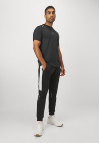 Ellesse UNASTAN PANT - Træningsbukser - black