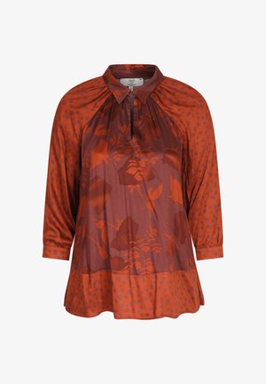 Bruine blouse met een kraag, lange mouwen en gemengde patronen van bladeren en stippen. Glad katoen met een vloeiende uitstraling.