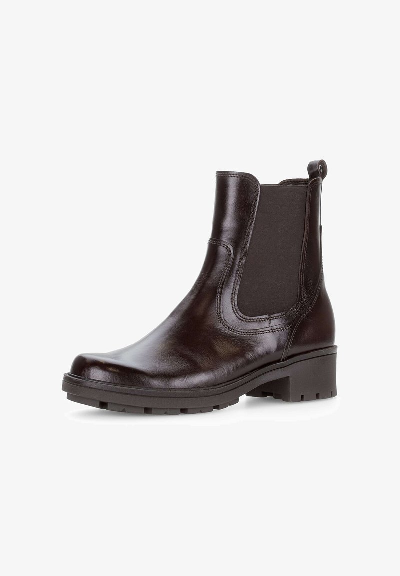 Bruine leren enkelboot met elastische zijpanelen, ronde neus, lichte plateauzool en getextureerde rubberen loopzool voor grip.