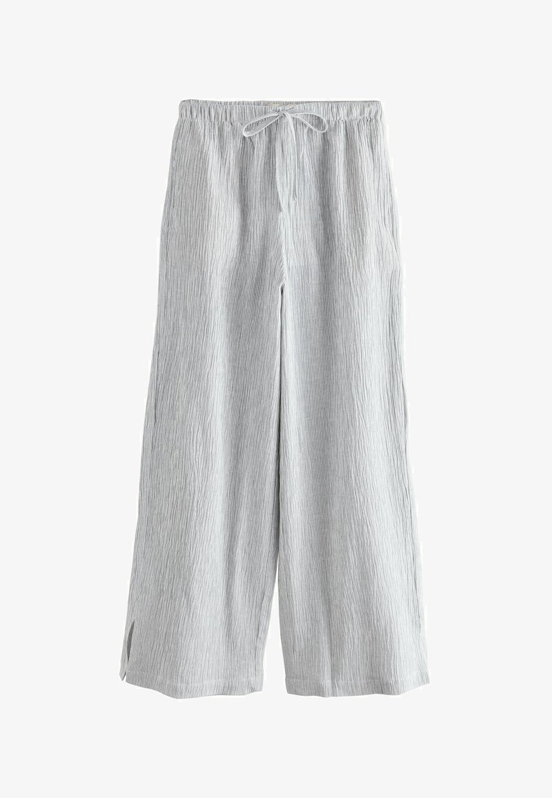 Pantalon large à rayures grises avec taille élastique, cordon de serrage, fentes latérales et tissu texturé.