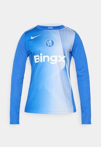 Hosszú ujjú sportmez gradienst kék színben, fehér Nike logóval, klub emblémával és "Bingx" felirattal. Simább anyag, diszkrét lineáris mintával.