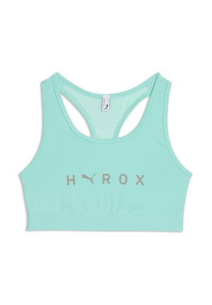 Lyse turkis sports-bh med racerback-design og "H Y R O X"-logo i grå foran, med et lille Puma-logo mellem bogstaverne.