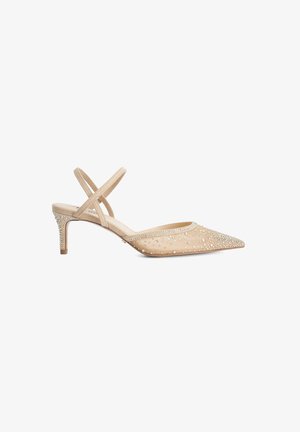 Beige pointed-toe slingback heel adorned with small rhinestones on the toe and heel, featuring two thin crisscross straps.