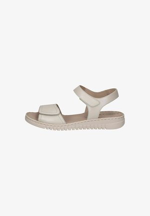 Sandale beige clair dotée d'un dessus en cuir texturé, de sangles ajustables et d'une semelle intérieure rembourrée. La semelle en caoutchouc présente un motif strié pour une meilleure traction.