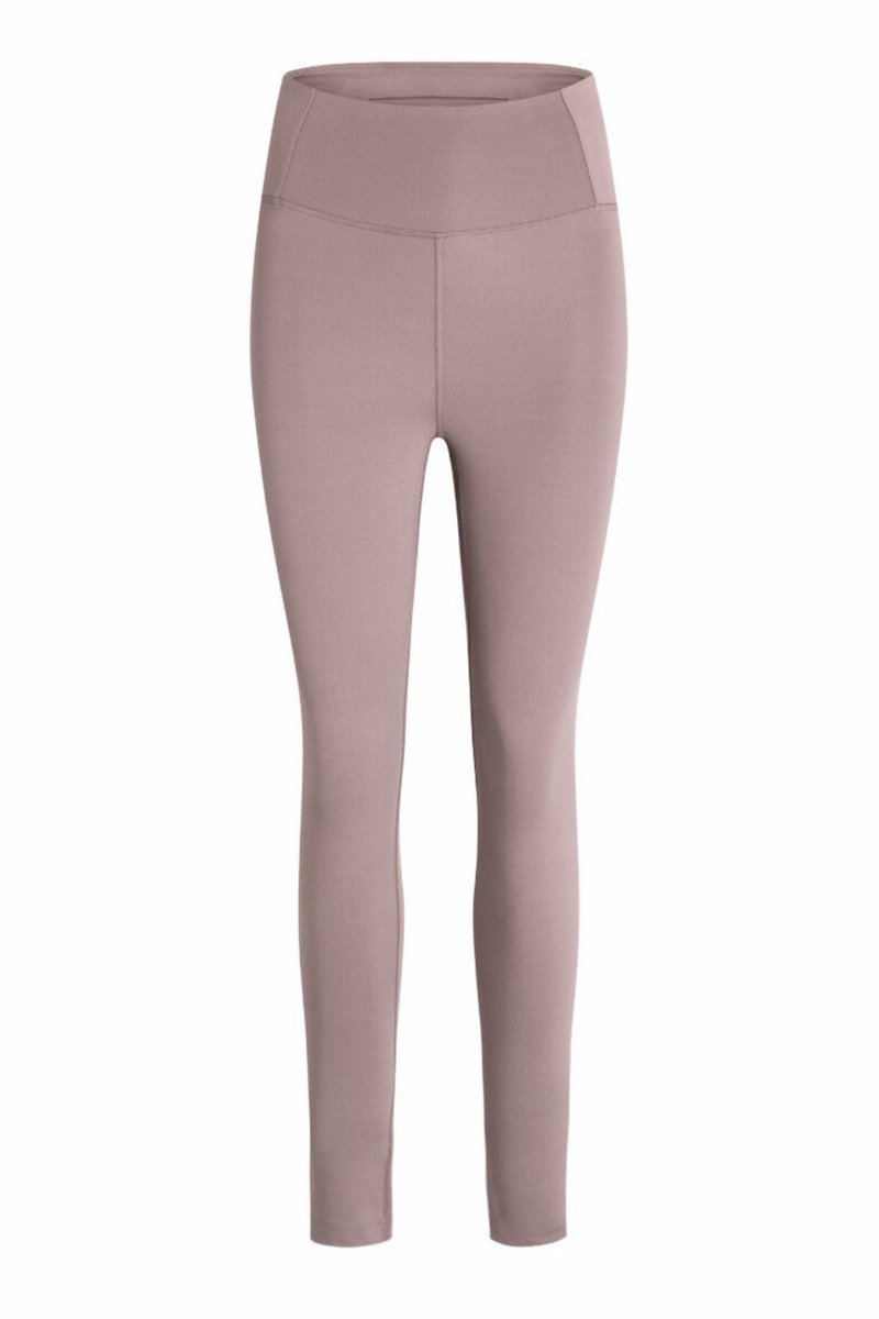 Ljuslila leggings med hög midja. Tillverkade av texturerad stretchtyg för komfort och flexibilitet. Inga synliga mönster eller dekorationer.