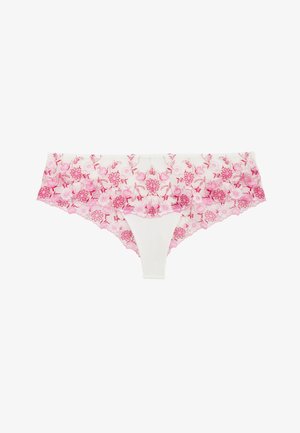 Culotte en dentelle blanche pour femme avec broderie florale rose et bordures festonnées, vue de face sur fond blanc.