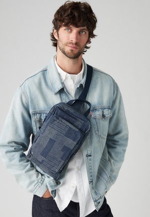 ZIP SLING UNISEX - Cross body bag - blue combination