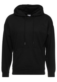 Black pullover hoodie made of soft cotton blend, featuring a front pocket, a drawstring hood, and ribbed cuffs. Minimalist design.