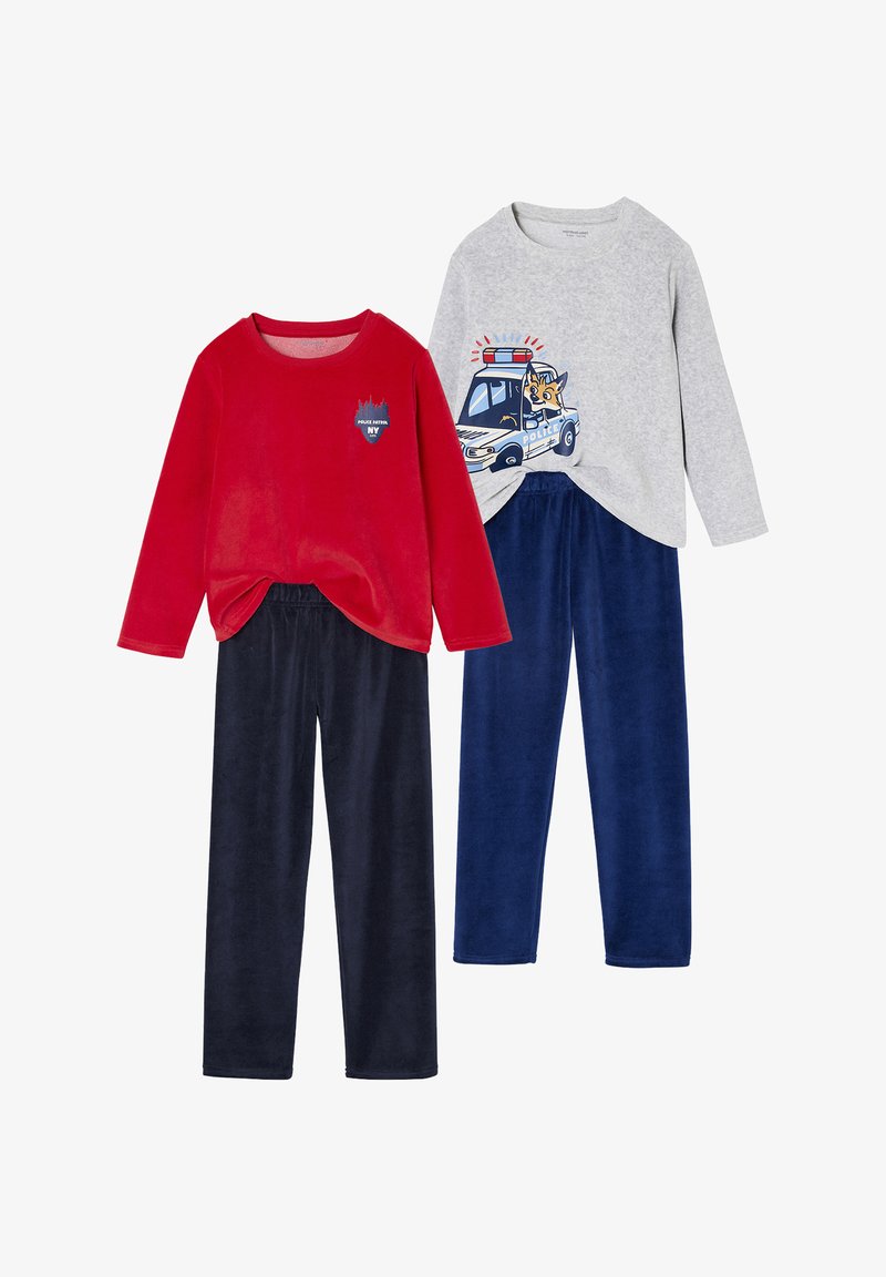 Two sets of children's pajamas: a red velour long-sleeve top with a logo, and a grey top with a police car graphic, paired with navy blue pants.