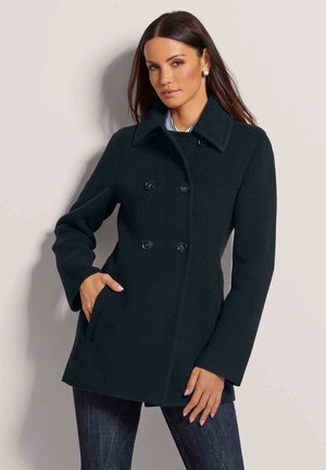 Dark green wool blend coat featuring a double-breasted design, large collar, front pockets, and two black buttons on each side.