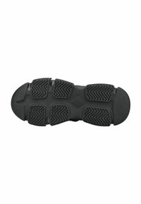 Suela de zapato de goma negra con un diseño de relieve que presenta múltiples secciones redondeadas y agarres en zigzag para mejorar la tracción y durabilidad.