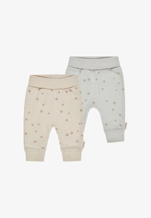 Zwei Paar Kleinkinderhosen: eine in Creme mit rosa Pfotenabdrücken, die andere in Hellblau mit ähnlichen Abdrücken. Beide haben einen weichen Bund und Bündchen.