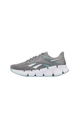 Scarpa da corsa grigia e verde petrolio con suola bianca segmentata e tomaia in mesh, vista lateralmente su sfondo bianco.