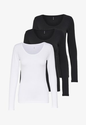 Drei Langarm-T-Shirts in Schwarz und Weiß. Aus weichem Baumwollstoff, mit Rundhalsausschnitten, körperbetontem Schnitt und auffälligen Nähten.