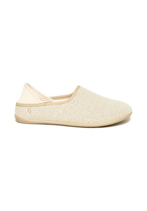 Beige slip-on shoe with a textured fabric upper, smooth tan accents, flexible sole, and minimalistic design. Features a small logo on the side.