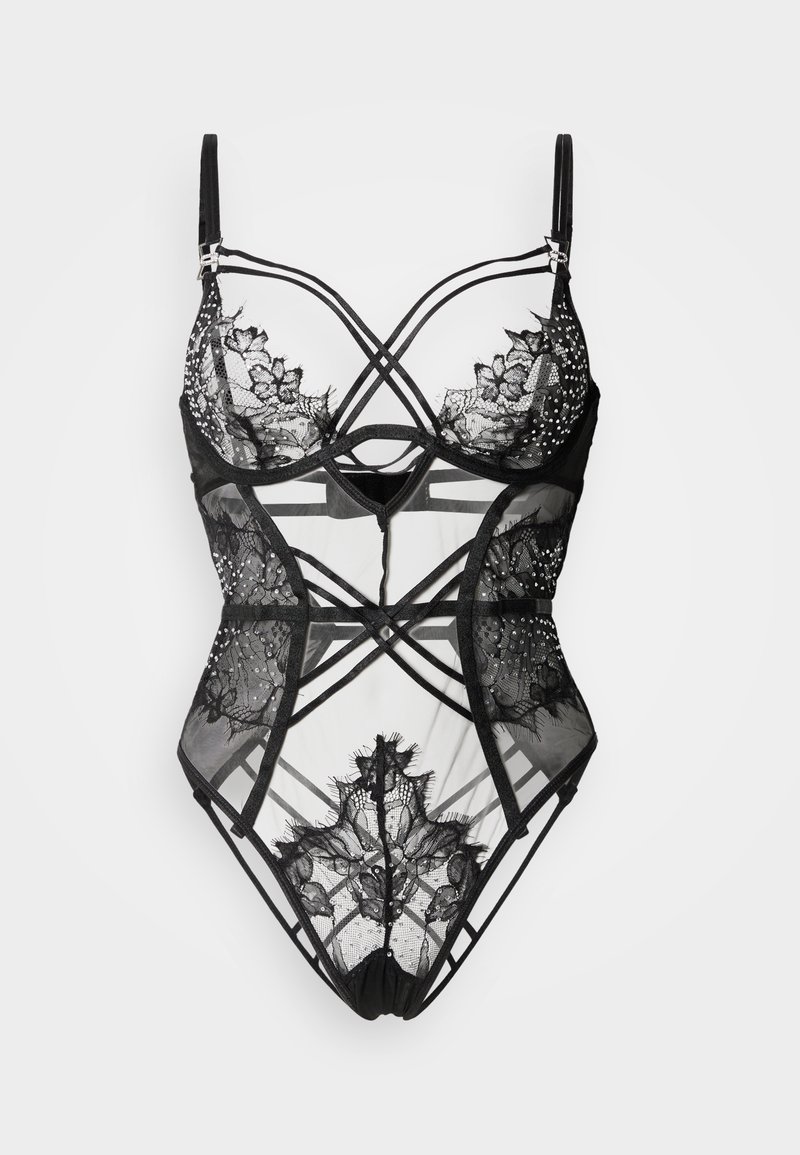 Μαύρο κορμάκι από δαντέλα με διαφανείς πάνελ, περίτεχνα λουλουδάτα σχέδια και λουριά που διασταυρώνονται. Διακοσμημένο με ρυθμιζόμενα μεταλλικά στοιχεία.