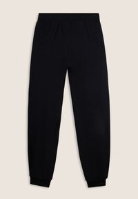 Pantalon de jogging noir en tissu doux avec une taille élastique et des chevilles ajustées. Texture lisse, sans motifs ni accents visibles.