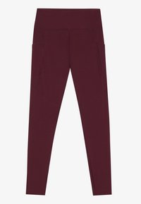 Leggings burdeos con cintura alta, que cuentan con dos bolsillos laterales y una textura suave y elástica. Costuras planas para mayor comodidad.
