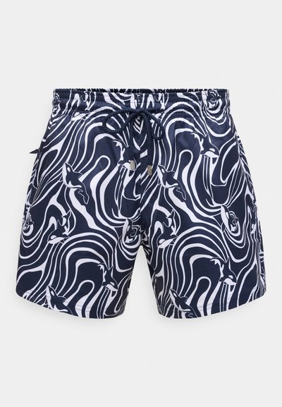 Jūras spēku peldbikses ar baltu abstraktu griešanās rakstu un delfīnu dizainiem. Piedāvā elastīgu jostu un saites, lai pielāgotu piemērotību.