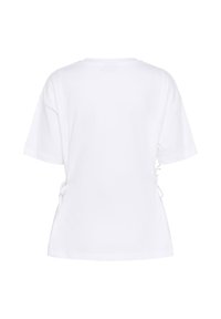 Witte katoenen t-shirt met een losse pasvorm, korte mouwen en verstelbare zijknopen voor vormgeving. Zachte textuur met een eenvoudig ontwerp.