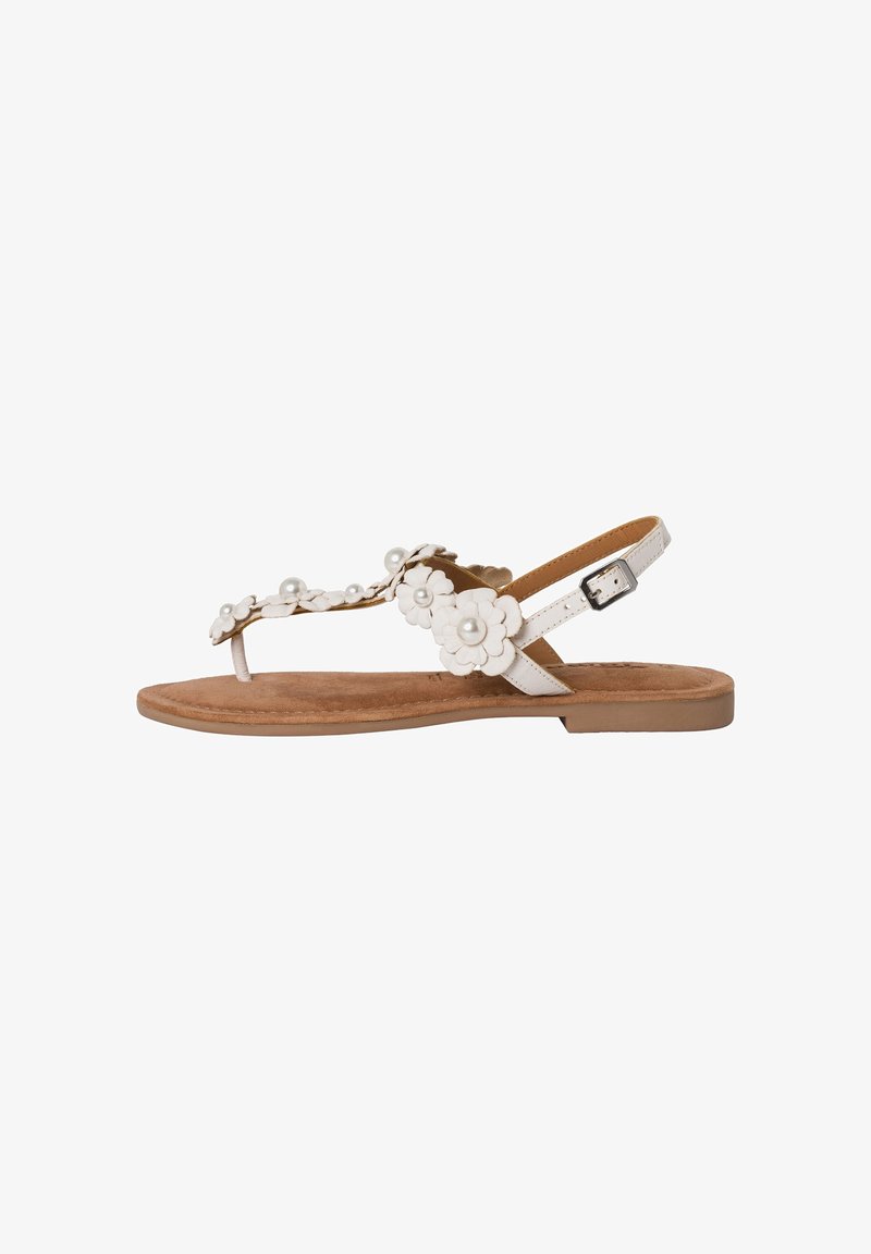White floral sandals with pearl accents, flat sole, adjustable strap, suede-like footbed, open-toe design, and minimalist style.