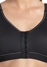 Schwarzer Sport-BH mit V-Ausschnitt, vorderem Hakenverschluss und kontrastierenden weißen Nähten. Hergestellt aus glattem, dehnbarem Material.