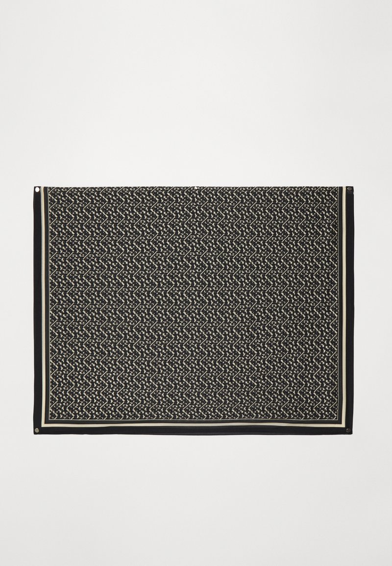 Black patterned scarf featuring a geometric design with cream accents, finished with a solid black border and metal corner grommets.