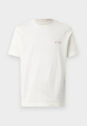 White cotton t-shirt with a round neckline. Features subtle ribbing around neck and a small, embroidered logo on the left chest.