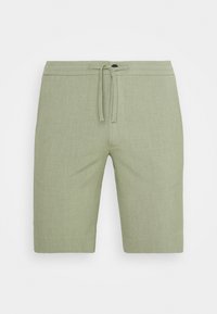 Světle zelené šortky vyrobené z texturovaného materiálu. Mají pružný pas s šňůrkou a knoflíkem pro zapínání.