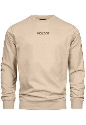 Beige sweatshirt laget av mykt materiale med lange ermer. Har "INDICODE"-logo på brystet og tekst langs ermene. Klassisk passform.