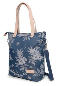 Navy blue tote bag with floral print, made of fabric, featuring light leather handles and an adjustable strap; zip closure on top.