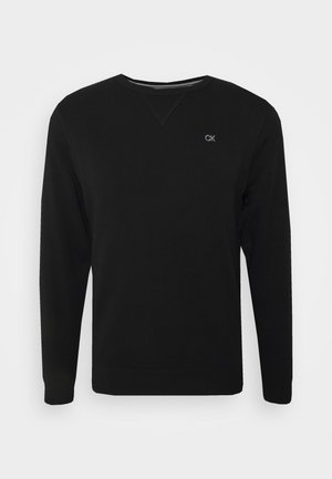 Sweatshirt preto feito de algodão, com gola redonda, mangas longas e um pequeno logo bordado no lado esquerdo do peito. Textura suave.