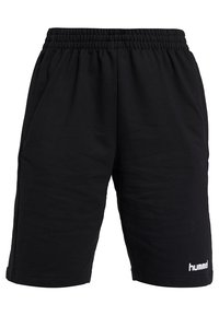 Pantalones cortos deportivos negros hechos de una tela suave, con una cintura elástica y un logo blanco en la parte inferior de la pierna izquierda.