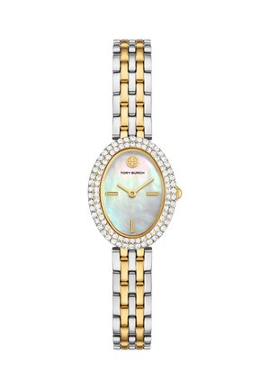 Zegarek na rękę o owalnej tarczy z masy perłowej, wskazówki w kolorze złota, luneta ozdobiona kryształkami oraz dwukolorowa bransoleta z srebra i złota.