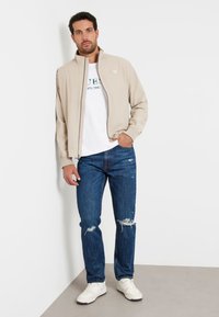 Guess Lengva striukė - beige