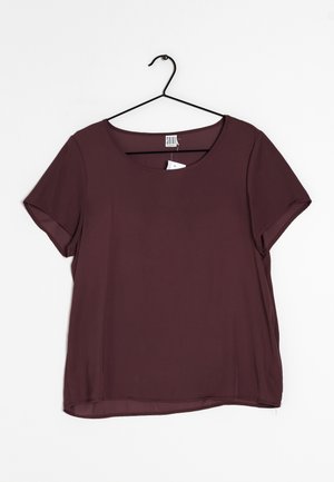 Burgundy short-sleeved blouse with a round neckline, made from smooth, lightweight fabric; features a subtle sheen and a relaxed fit.