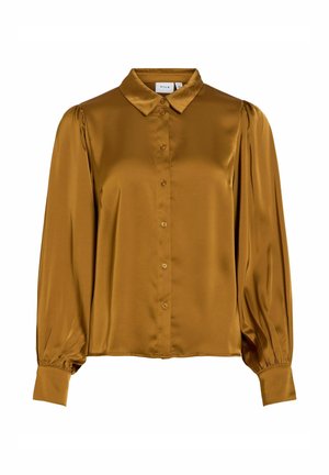 Pitkähihainen sinappikeltainen satiinipusero, jossa edessä napit, klassinen kaulus ja istuvat kalvosimet, joissa on hihoissa laskostettu yksityiskohta.