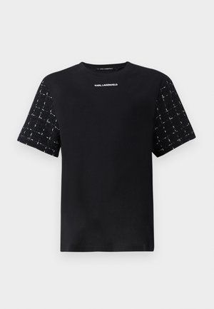 Musthave musta T-särk, millel on sile keha ja tekstuuriga mustriga lühikesed varrukad. Rinna peal on valges kirjas "Karl Lagerfeld" logo.