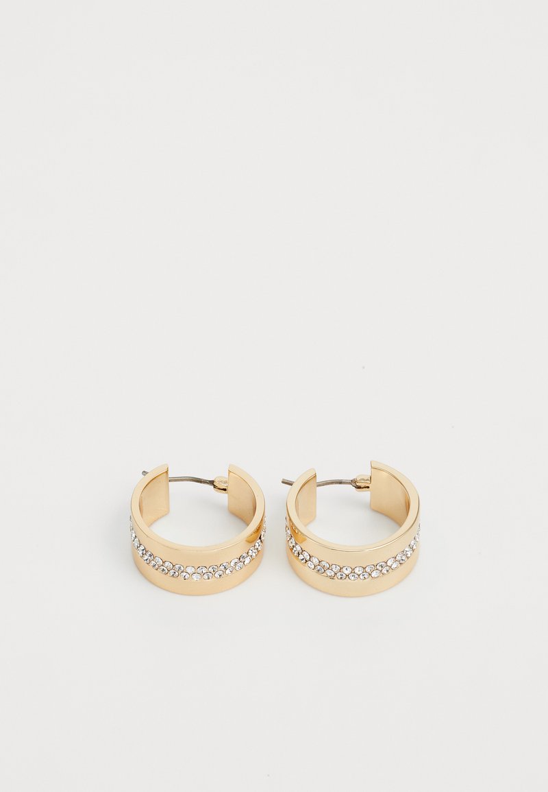 Gullørdører med en glatt, polert overflate. En rad med klare rhinesten pryder midten. Har en hengslet låsdesign.