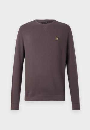 Brun sweatshirt med rund hals, långa ärmar, ribbade muddar och nederkant, med en liten gul logotyp på vänster bröstområde.