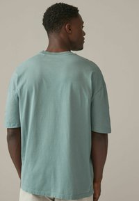 Next RELAXED FIT zielony