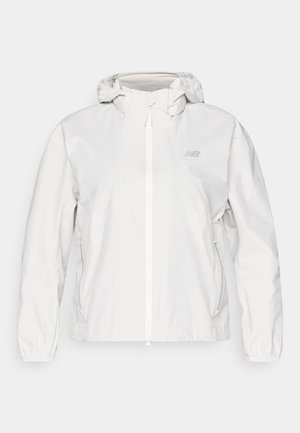 Weiße leichte Jacke mit durchgehendem Reißverschluss, Kapuze, elastischen Bündchen und zwei Seitentaschen. Besitzt ein dezentes Logo auf der Brust.