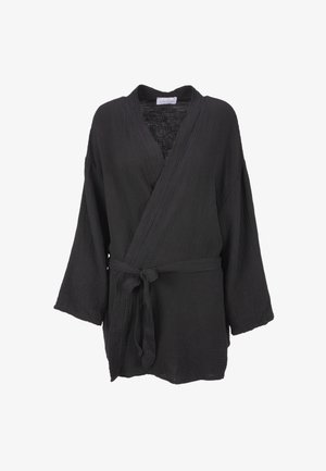 Black, woven wrap top with a v-neck, wide sleeves, and a tied waistband. Textured fabric with a soft, lightweight appearance.