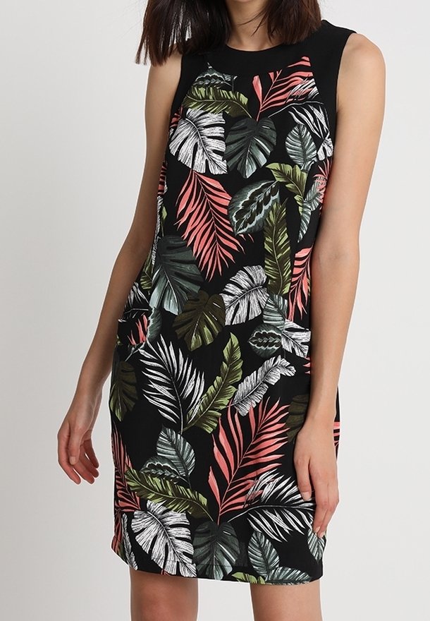 Sleeveless black dress featuring vibrant tropical leaf patterns in green, pink, and white. Soft fabric with a fitted style and round neckline.
